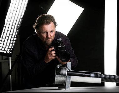 FOTOGRAFIE Mann mit Bart und Kamera